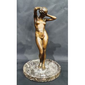 A bronze figural centrepiece, depicting a female figure…