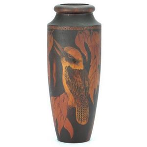 Pokerwork kookaburra vase of turned elongated form, showing a…