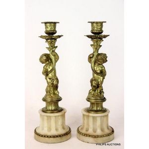 Sold at Auction: Tall pair of Continental brass pricket candlesticks,  17th/18th century, The hexagonal drip pan above faceted baluster column  supported