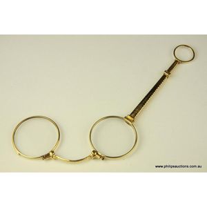 A fourteen carat gold antique folding Lorgnette, 19th century,…