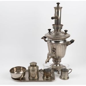 A Russian silver finished samovar by Morozov, with two tea…