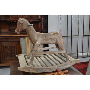 An antique carved naive childs rocking horse, approx 68 cm high,…