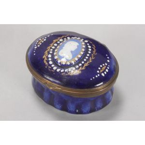 19th century enamel patch box, of oval form, the hinged cover…