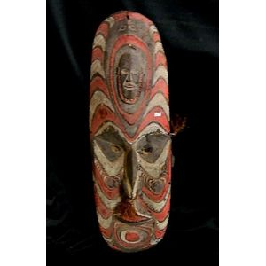 A Sepik ancestor sculpture in the form of an ancestor face,…