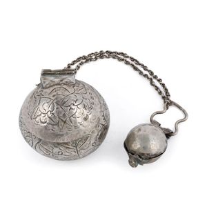 An antique Malaysian silver betelnut (sirih) set with ornate…