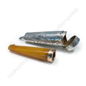 An Edwardian amber cigar holder in silver case, the holder with…