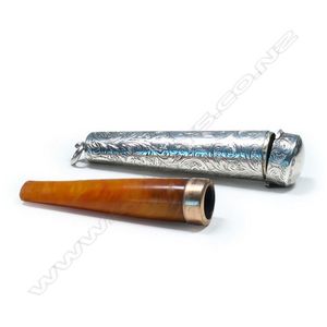 An Edwardian amber cigar holder in silver case, the holder with…