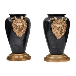 A pair of giltmetal mounted black marble urns, each with an…
