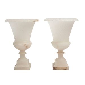 A mirror pair of alabaster urns, by Rossi, second half 20th…