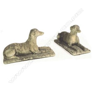 A pair of church stone greyhounds, in lying position, on plinth…