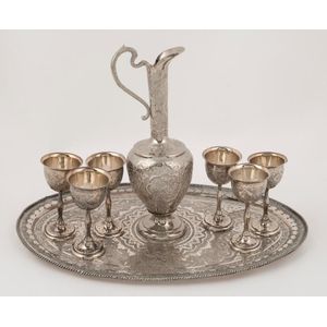 A Persian silver plated drink set, 20th century, (8 items), the…