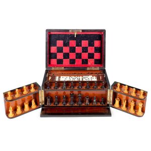 A Victorian walnut cased games compendium, with games including…