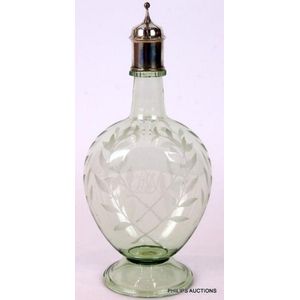 An engraved glass sterling silver topped decanter, 1906 London,…
