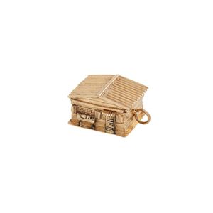 9ct gold music box pendant, modelled as a log cabin house…