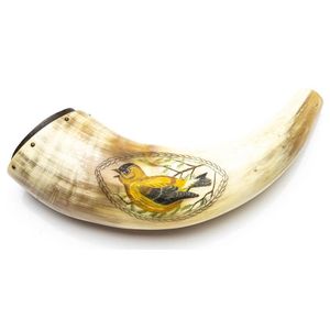 An antique powder horn with scrimshaw design of a yellow and…