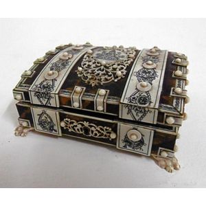 A superb ivory and tortoise shell case having ivory game pieces…