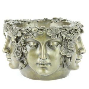 Bronze multi faced bowl signed A Moreau bearing five serene…