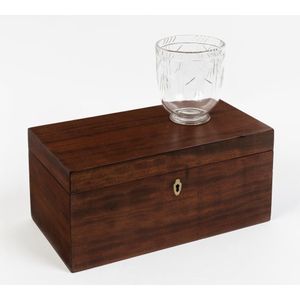 A mahogany tea caddy, 19th century, of plain rectangular form…