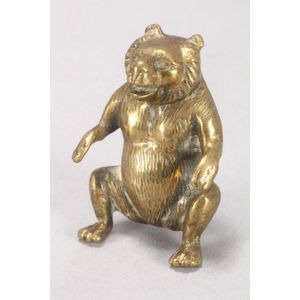 Miniature gilt bronze figure of a bear, depicted resting on…