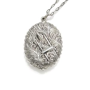 A Victorian style locket pendant necklace, pendant with feather&hellip;