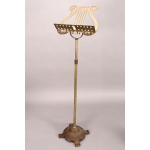 20th century brass music stand, of lyre form, with floral ledge…
