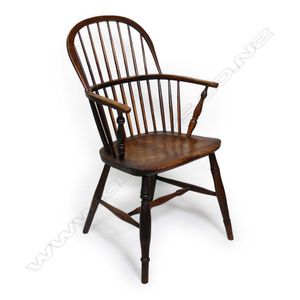 An early 19th century elm hoop back Windsor armchair, turned&hellip;