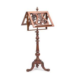 A Victorian carved mahogany music stand, 122 cm high