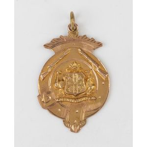 An antique Australian gold fob, the medallion having a central…