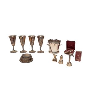 A collection of silverplate bar paraphernalia, including…