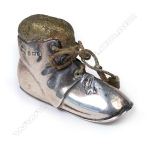 An Edwardian silver boot form pin cushion, modelled as an old…