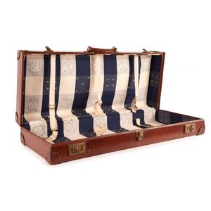 An early-20th century leather suitcase, of unsusal dimenions…