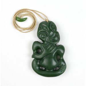 A modern Maori pounamu hei tiki, the right hand to chest, left…