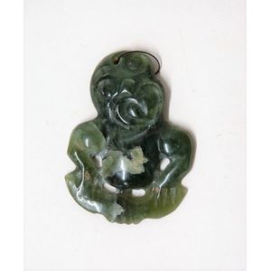 An early/mid-20th century Maori pounamu hei tiki, open heart…