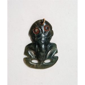 An old Maori pounamu (bowenite) small hei tiki, hands to thighs,…