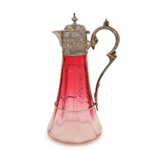 An antique cut ruby crystal claret jug with silver plated…