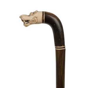 A VICTORIAN IVORY JANUS-HEADED BAMBOO WALKING CANE the pommel carved with  two grotesque back to ba