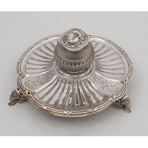 An antique French silver plated inkwell adorned with goats,…