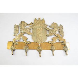 19th century ornate brass hook rack, mounted with shield crest…