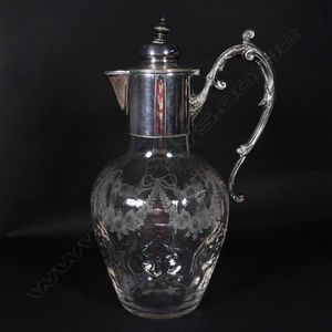An Edwardian crystal and silver plate claret jug, the mounts…