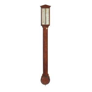 An oak cased stick barometer/thermometer, retailed by Flavelle…