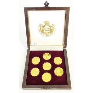 Seven gold Monaco commemorative medallions, cased. Total weight…