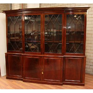 An English flame mahogany four door breakfront bookcase having&hellip;