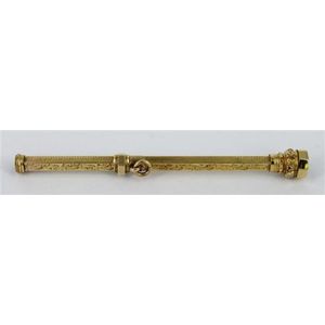 A gold propelling pencil, foliate design and machine turned…