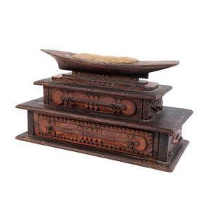 An impressive tramp art sewing box with canoe shaped pin…