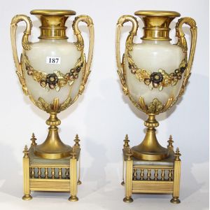 A pair of marble and brass mantle piece garnitures, together…