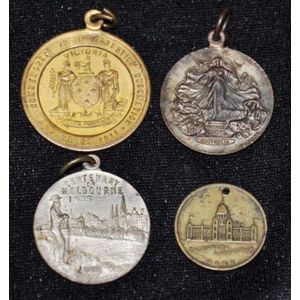 Four various Australian commemorative medallions including a…