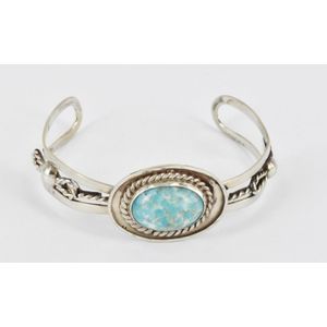 A Mexican silver cuff bangle, set with a turquoise imitation…