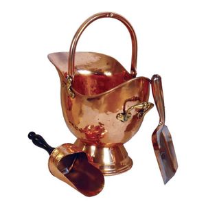 A Victorian copper helmet shaped coal scuttle with swing handle.…