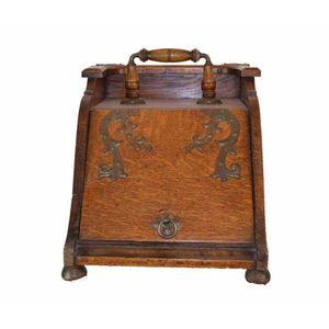A Victorian oak coal box, late 19th century. Height 37 cm,…