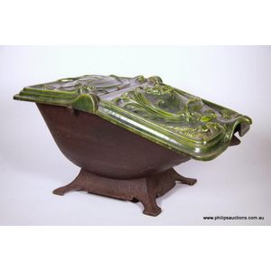 A fine Art Nouveau cast iron and green enamel coal scuttle,…